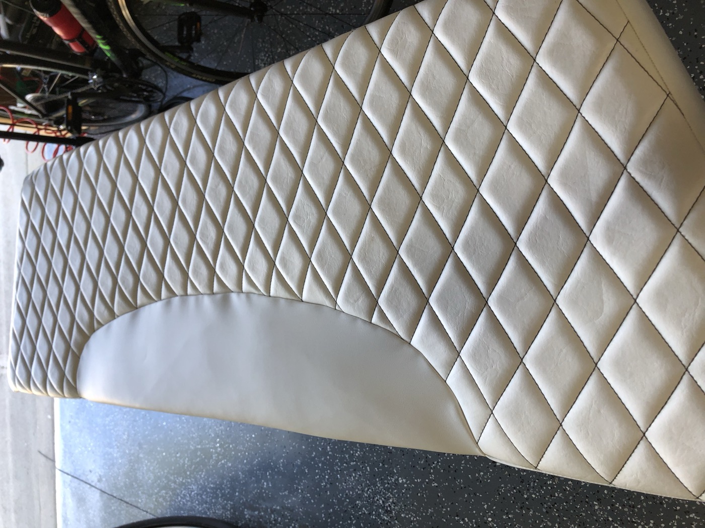 Seat with diamond-stitched upholstery