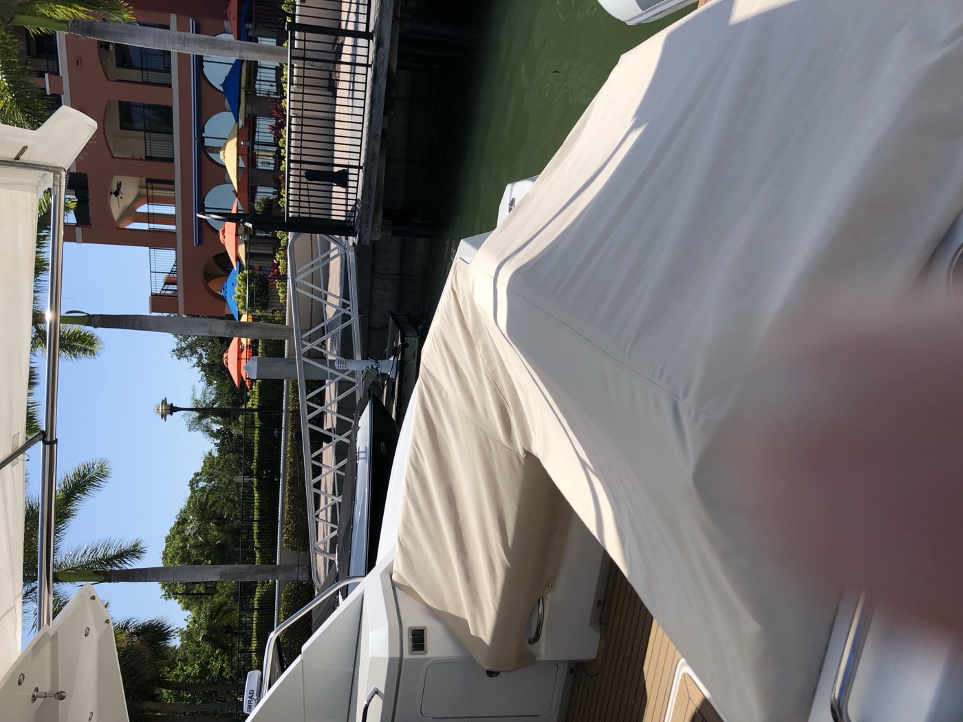 Boat with a custom-fitted cover at the dock